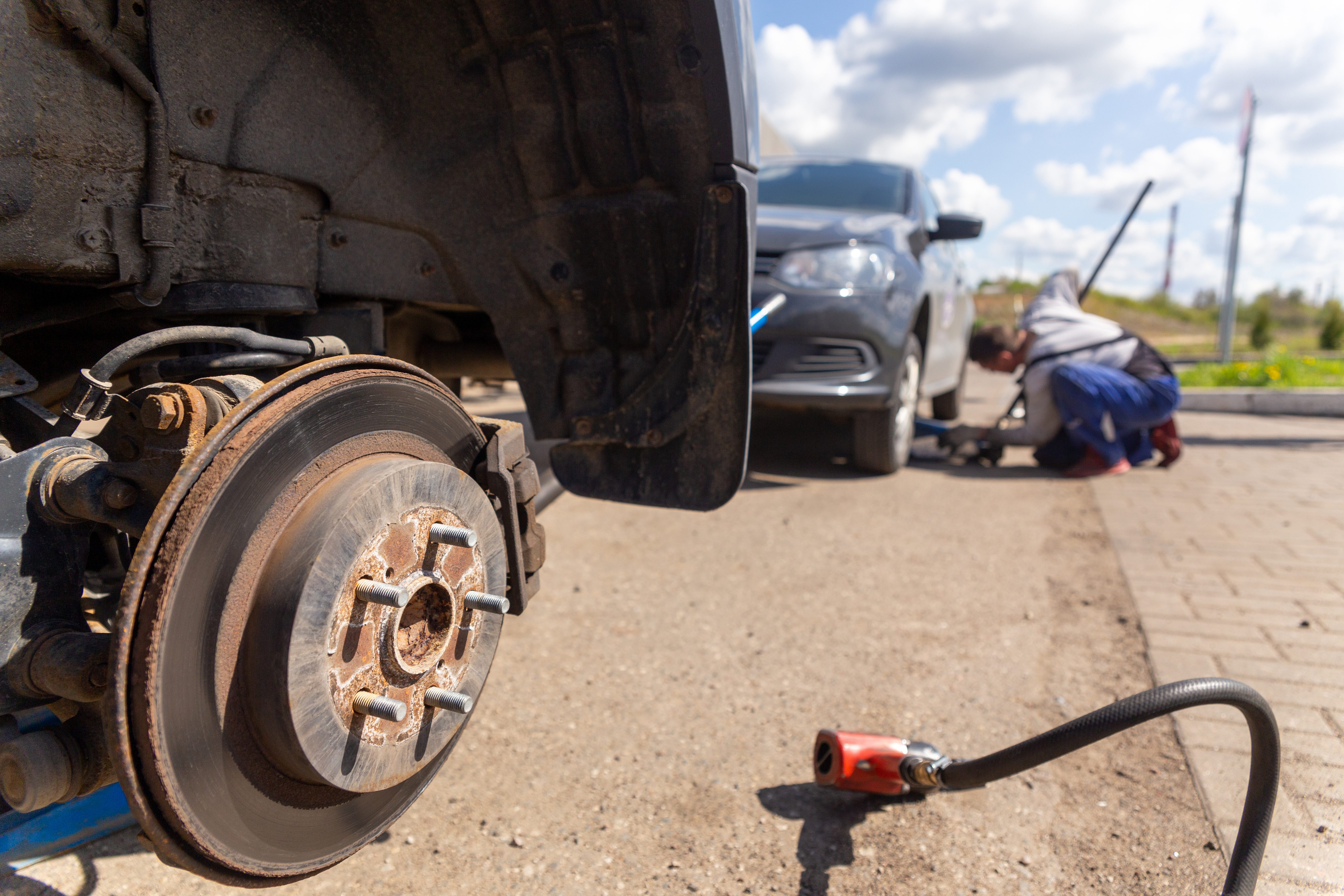A technician demonstrates hands-on expertise in vehicle recovery. 